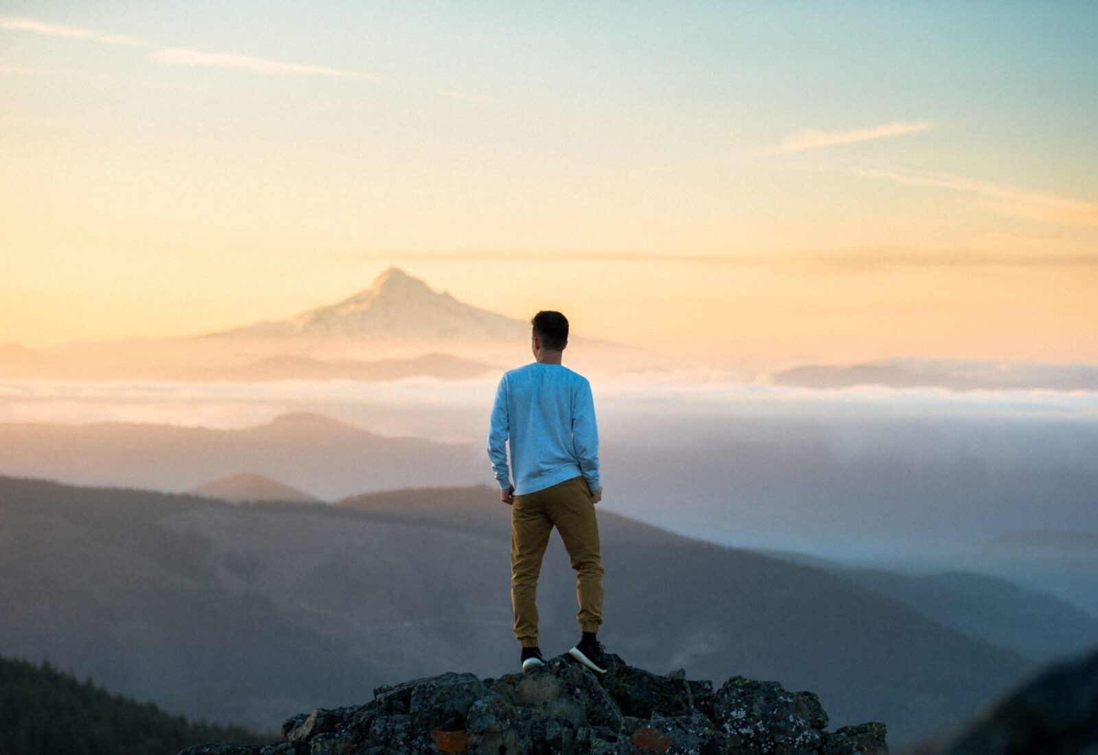man-standing-top-mountain-mindfully
