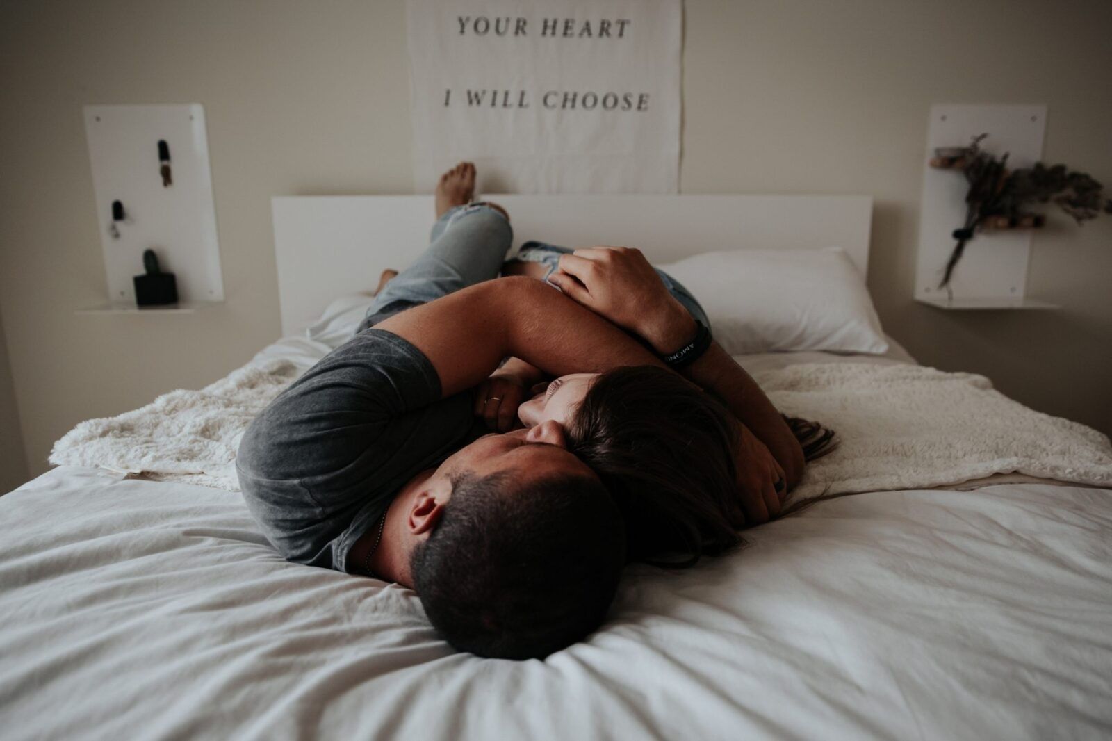 couple-cuddling-intimately-bed