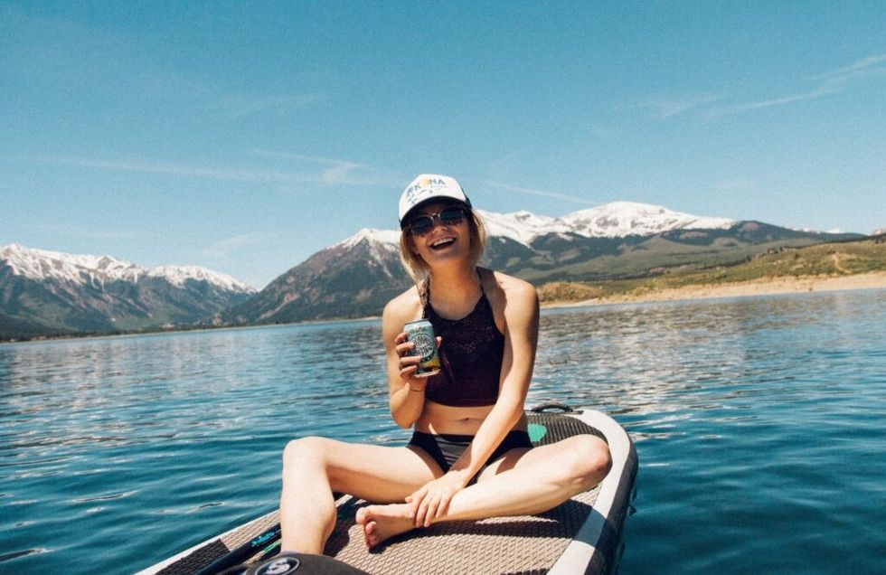 Woman-smiling-on-a-paddle-board