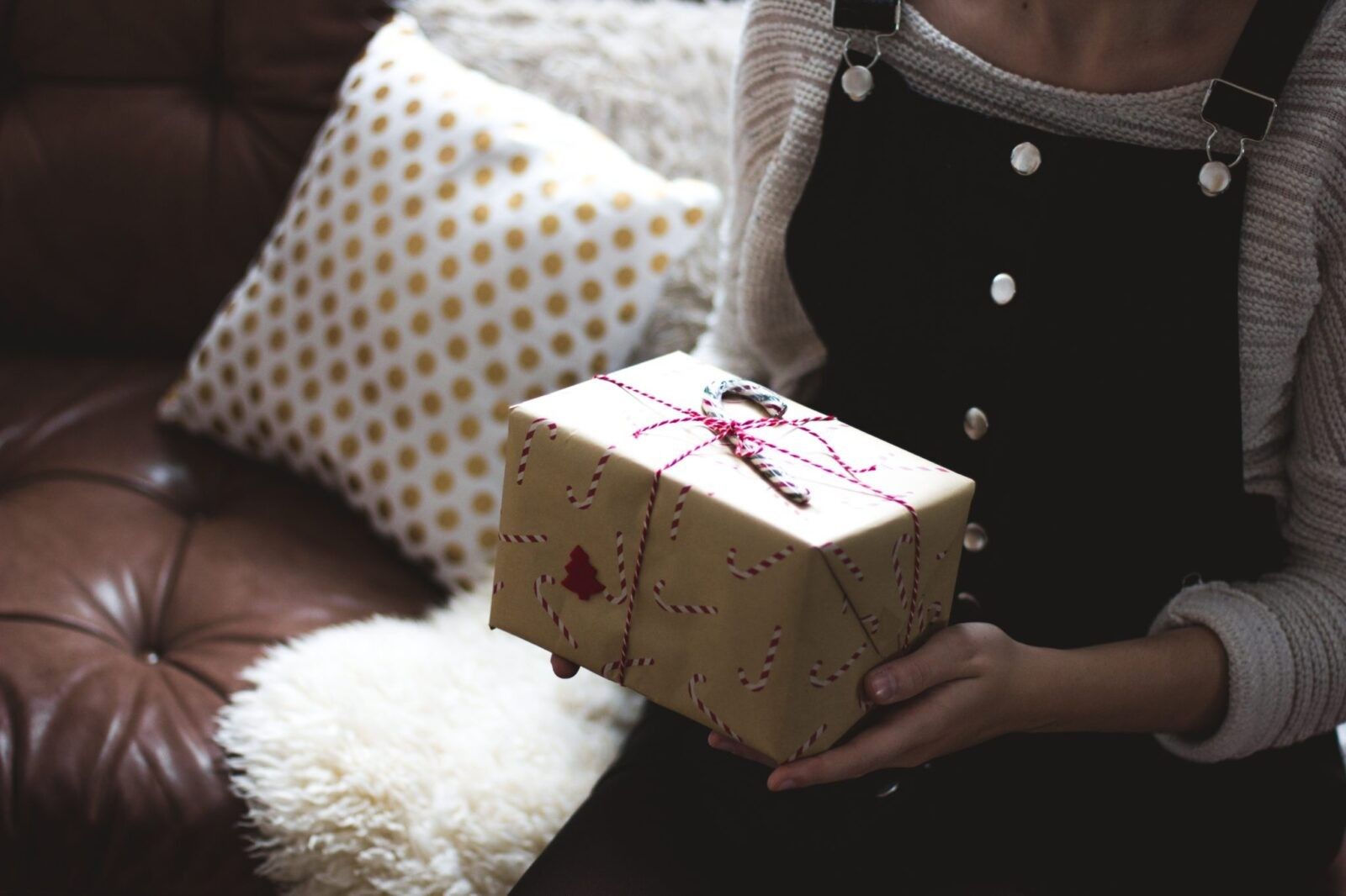 Woman-holding-a-wrapped-gift