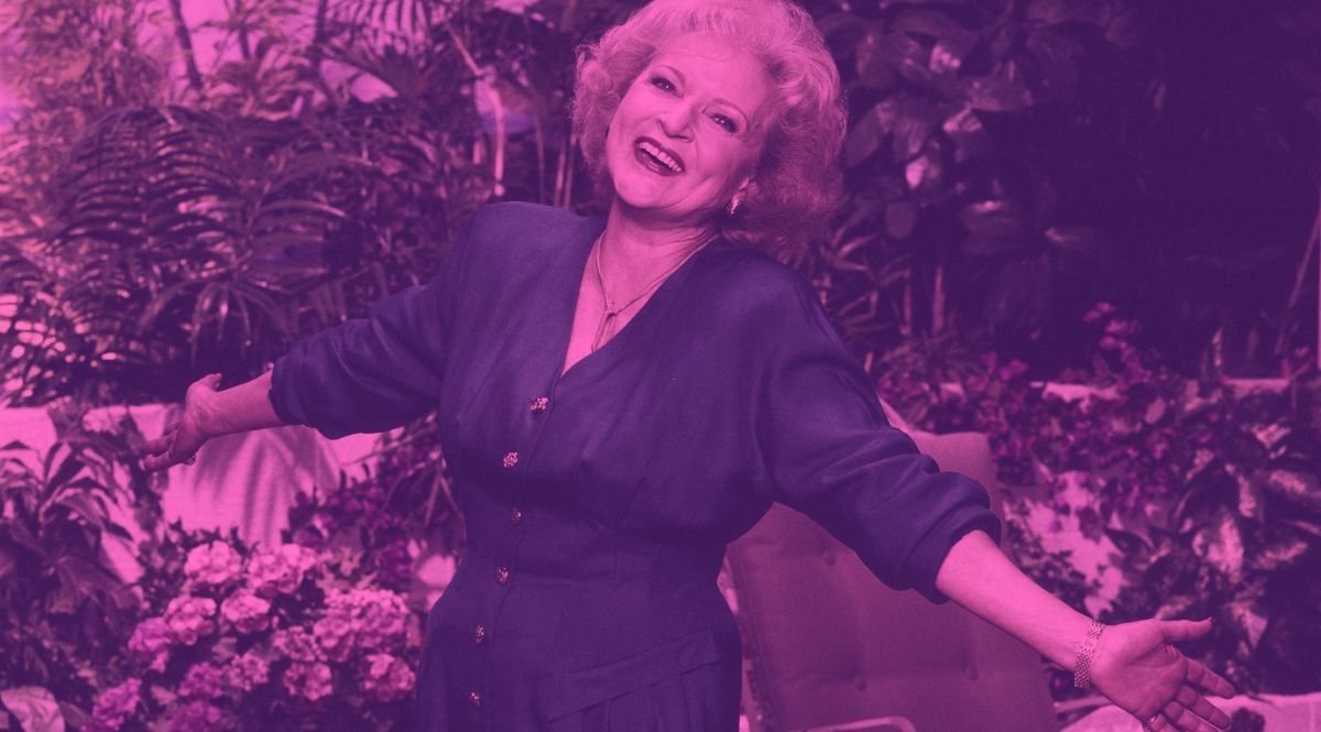 Betty White smiling arms open