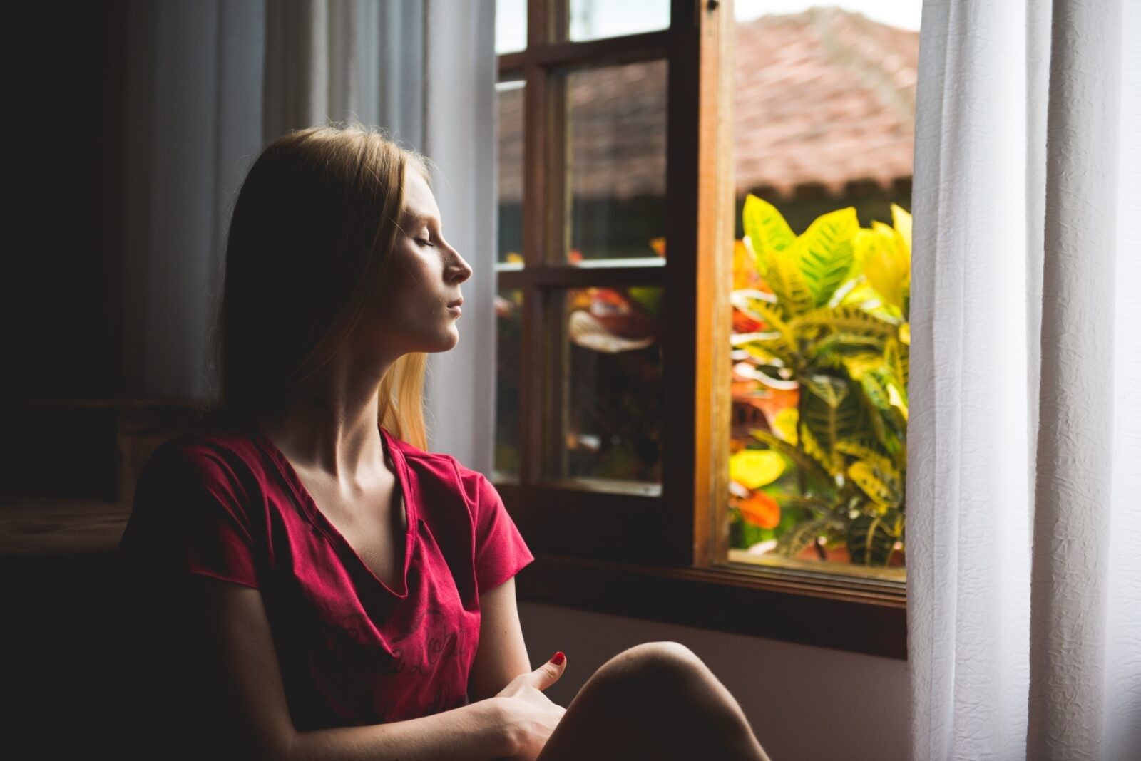 Woman-sitting-by-the-window