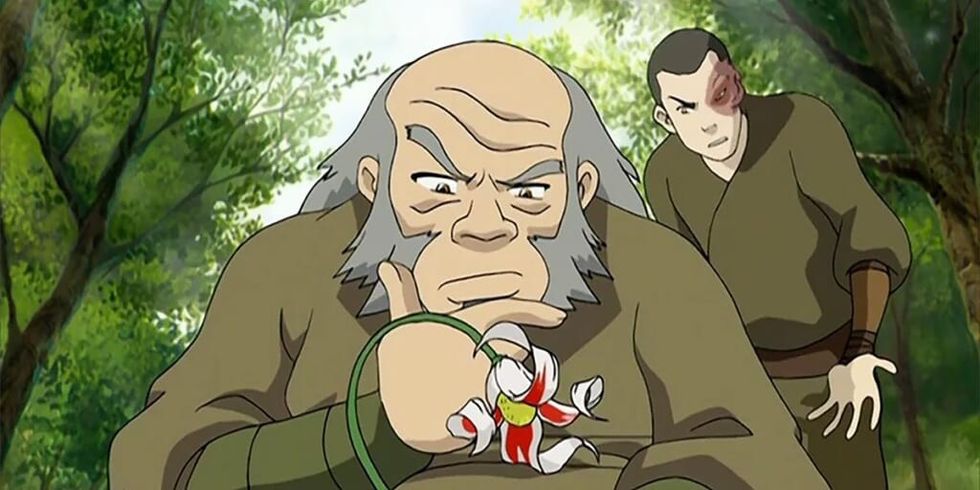 Uncle Iroh looking at flower with Zuko frustrated behind him