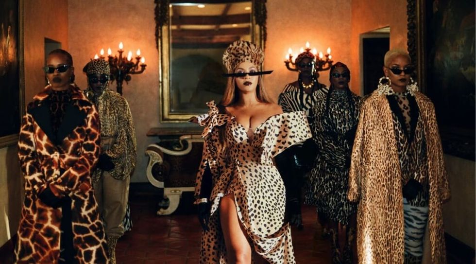 Beyonce Black is King wearing animal print dress. 