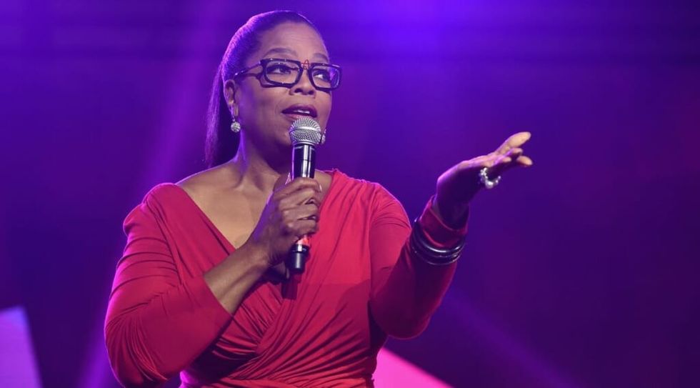 Oprah Winfrey talking to audience with mic