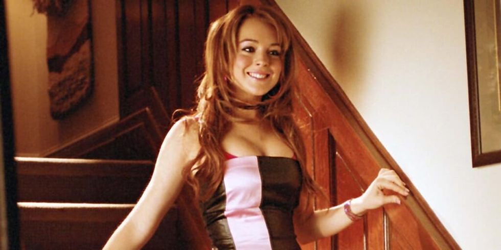 Cady Heron from Mean Girls in dress on staircase