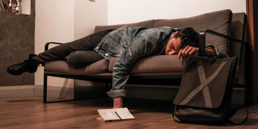 Man asleep on couch by Mert Kahveci on Unsplash