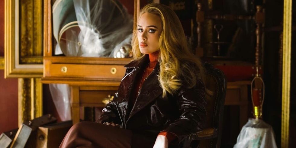 Adele sitting in chair, image from Easy on Me video