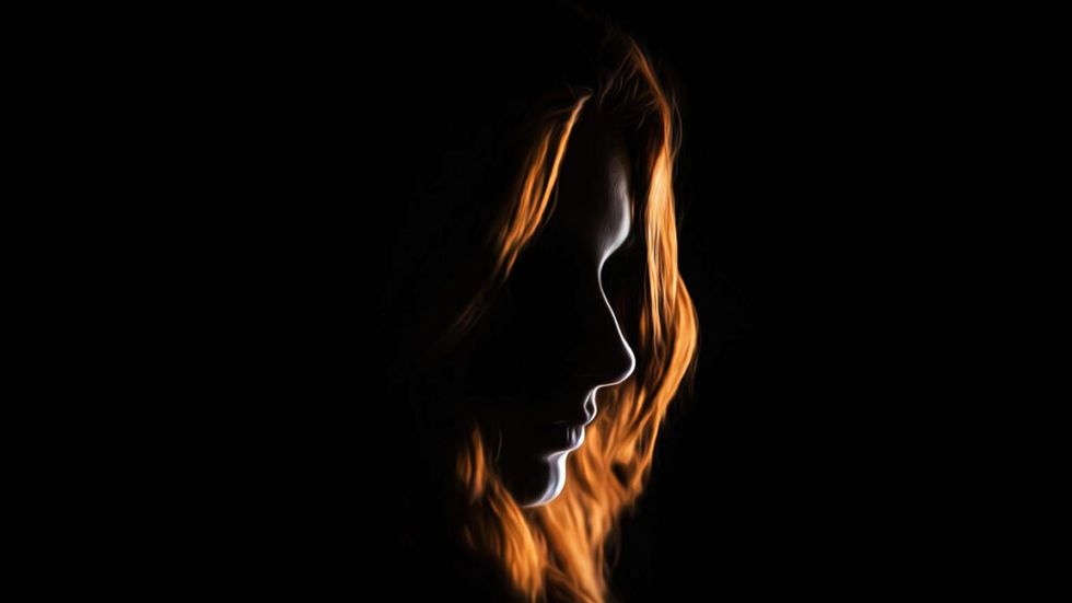 Red haired woman in silhouette