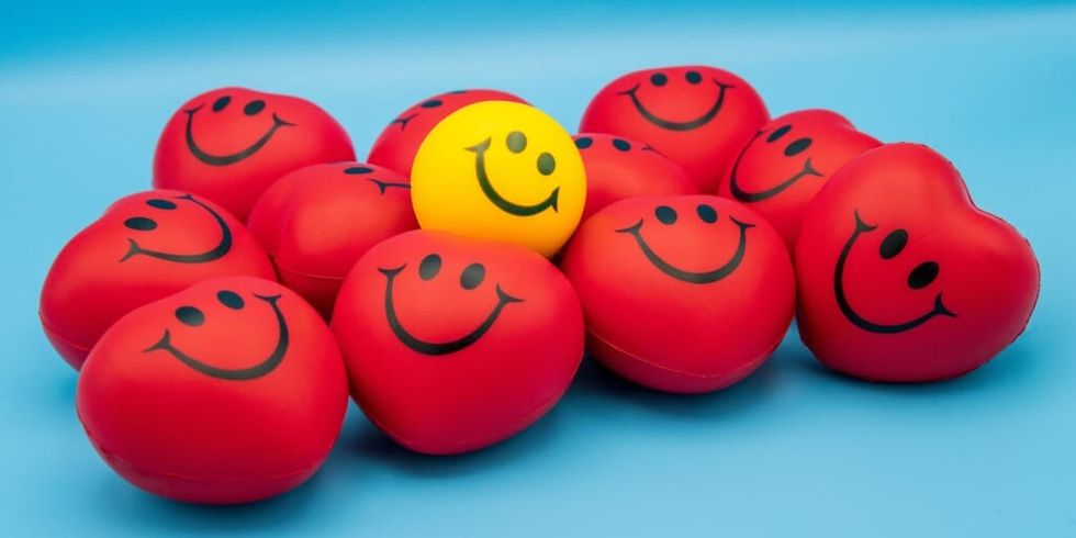 Stress balls with smiley faces by Count Chris on Unsplash