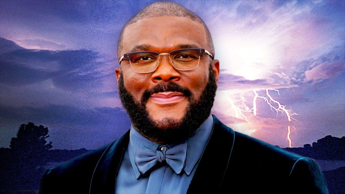 Tyler Perry smiling in front of a storm
