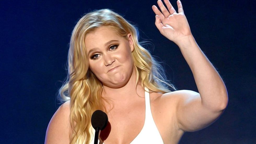 Amy Schumer waving on stage