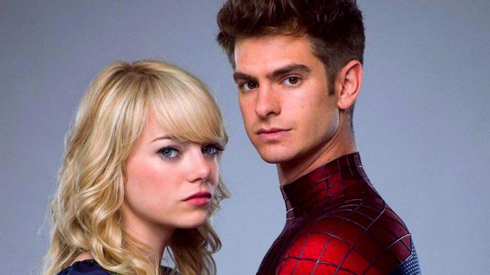 Andrew Garfield as SPider-Man and Emma Stone as Gwen Stacy hugging