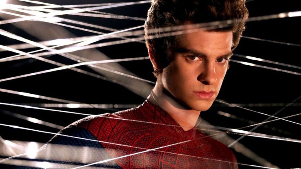 Andrew Garfield as Spider-Man surrounded by webs