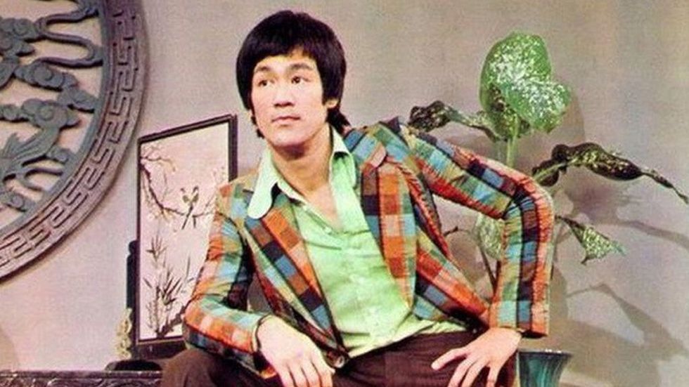 Bruce Lee in a ridiculous 70s coat