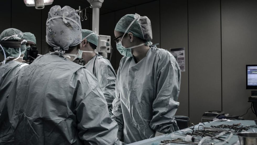 Doctors chat in an operating theater