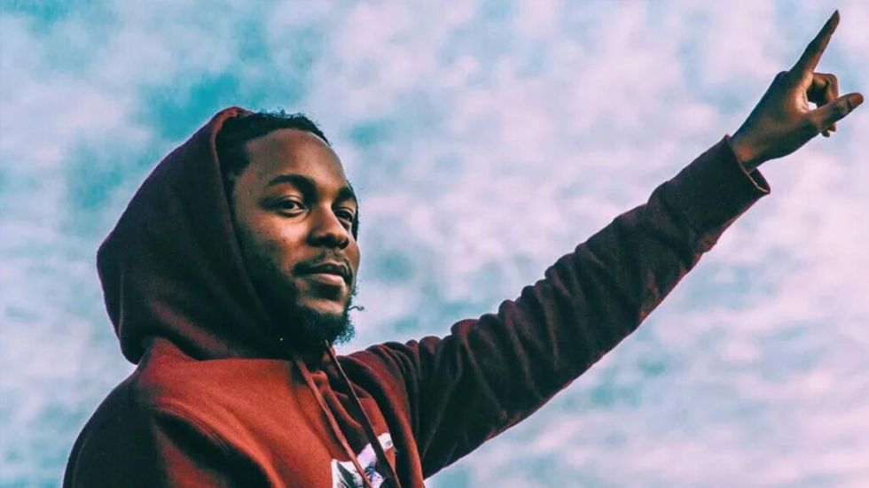 Kendrick Lamar pointing to the sky