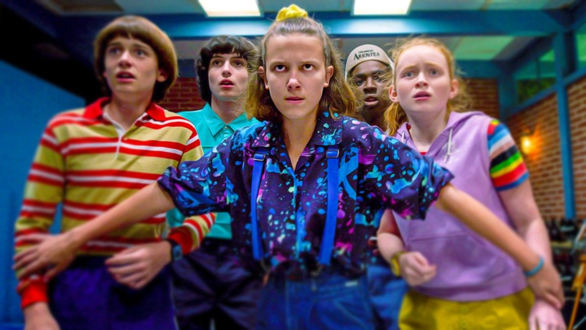 Millie Bobby Brown as Eleven in Stranger Things protecting the other kids
