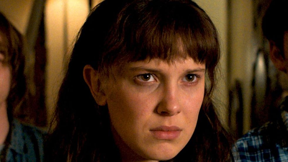 Millie Bobby Brown looking angry in Stranger Things as Eleven