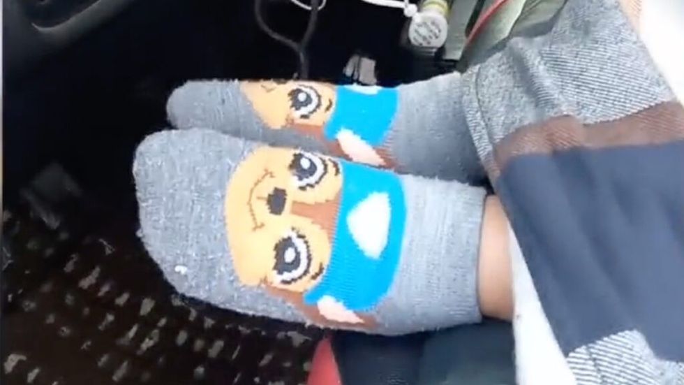 Toddler's feet wearing Paw Patrol socks