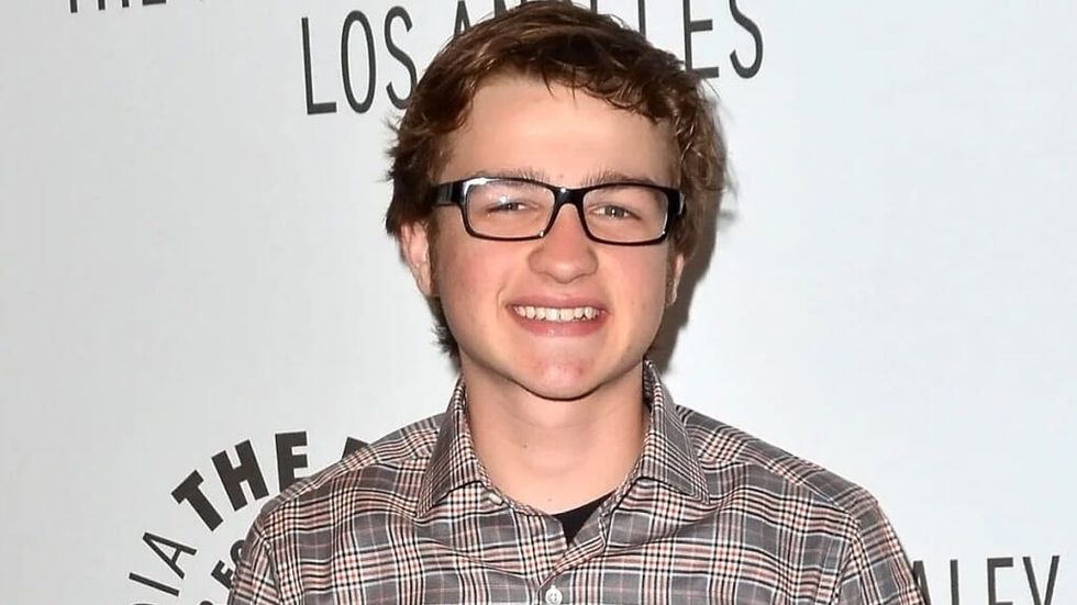 Angus Jones in glasses at a premiere for Two and a Half Men