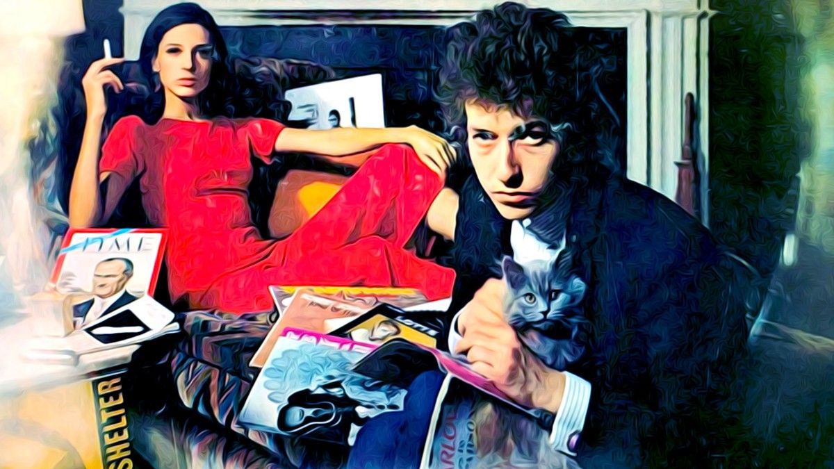 Bob Dylan with magainzes in front of a fireplace with a woman
