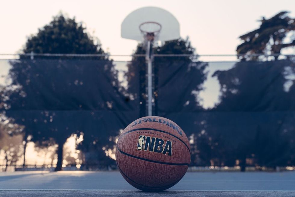 a basket ball lies on a basketball court