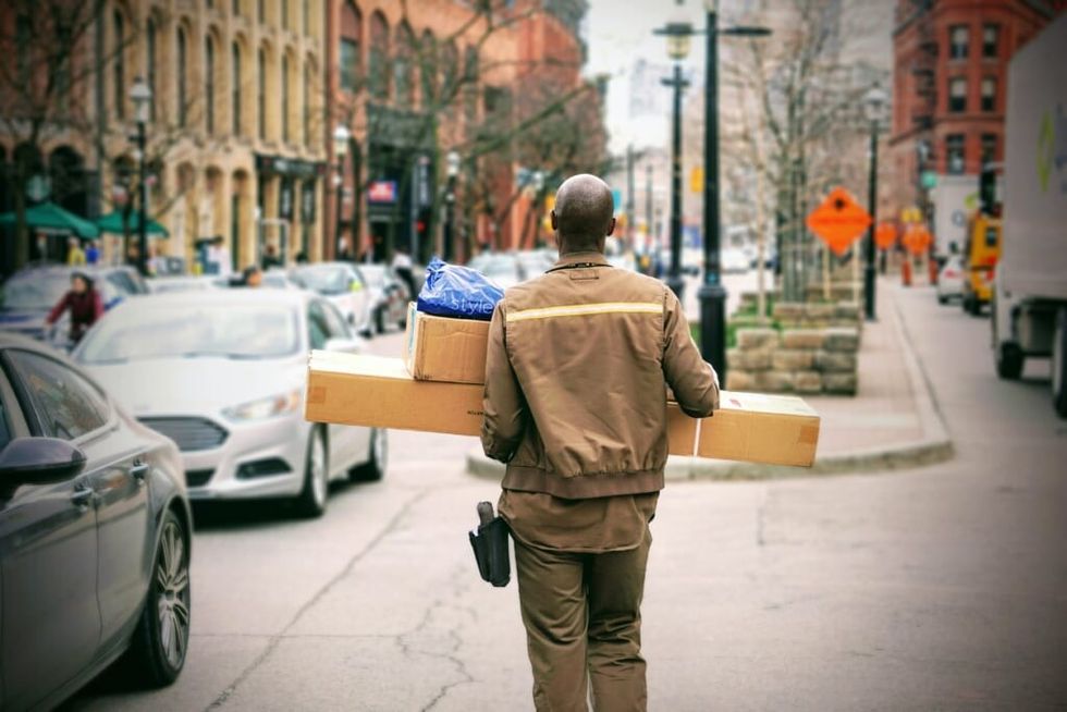 man carrying packages