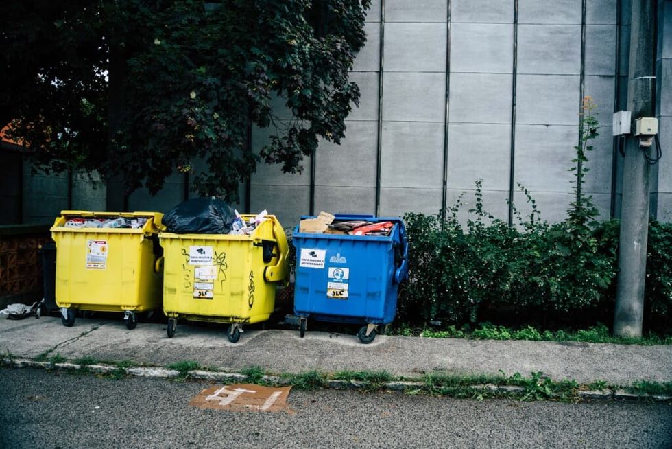 2 yellow and 1 blue trash can