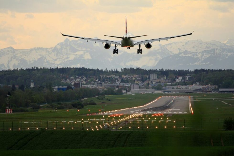 an airplane taking off on the runway