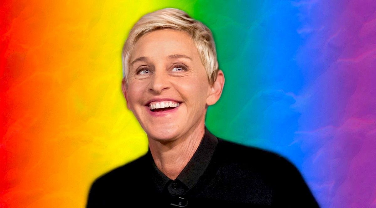 Ellen Degeneres smiling in front of a rainbow