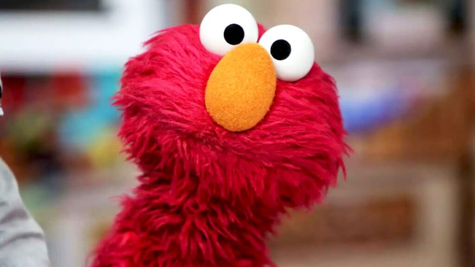 Elmo from Sesame Street looking at the viewer