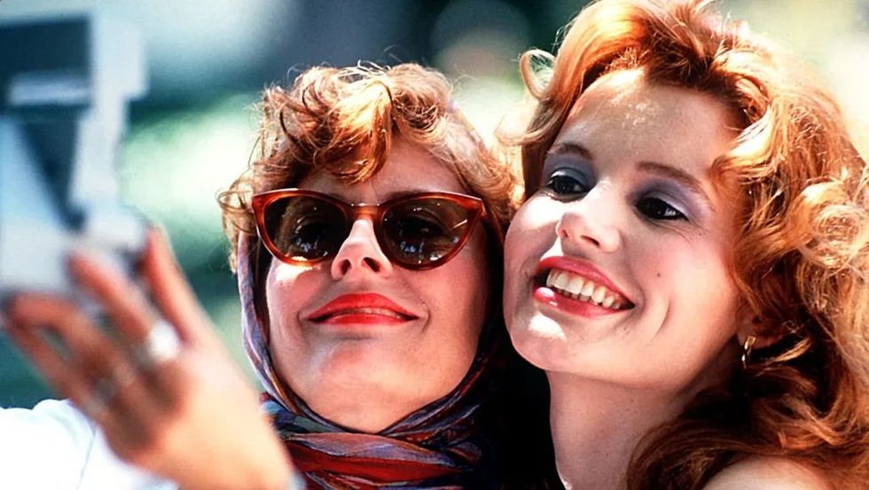 Geena Davis taking a picture in Thelma and Louise