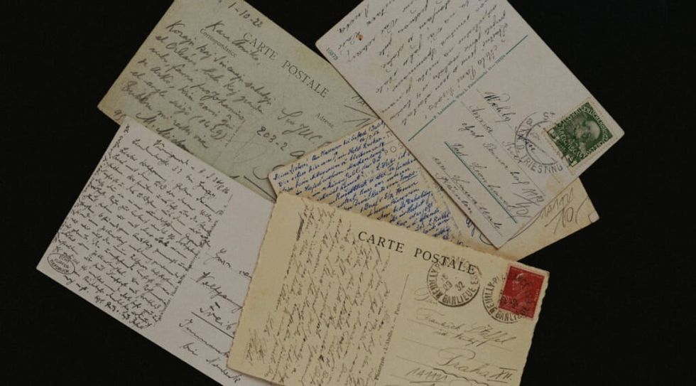 Pile of handwritten postcards