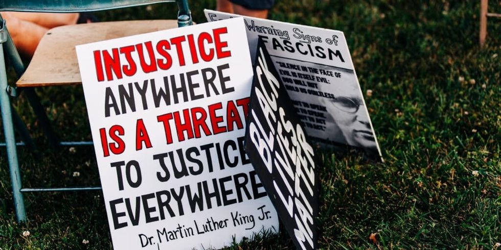 Protest signs at Black Lives Matter Knoxville's Juneteenth rally by Heather Mount on Unsplash