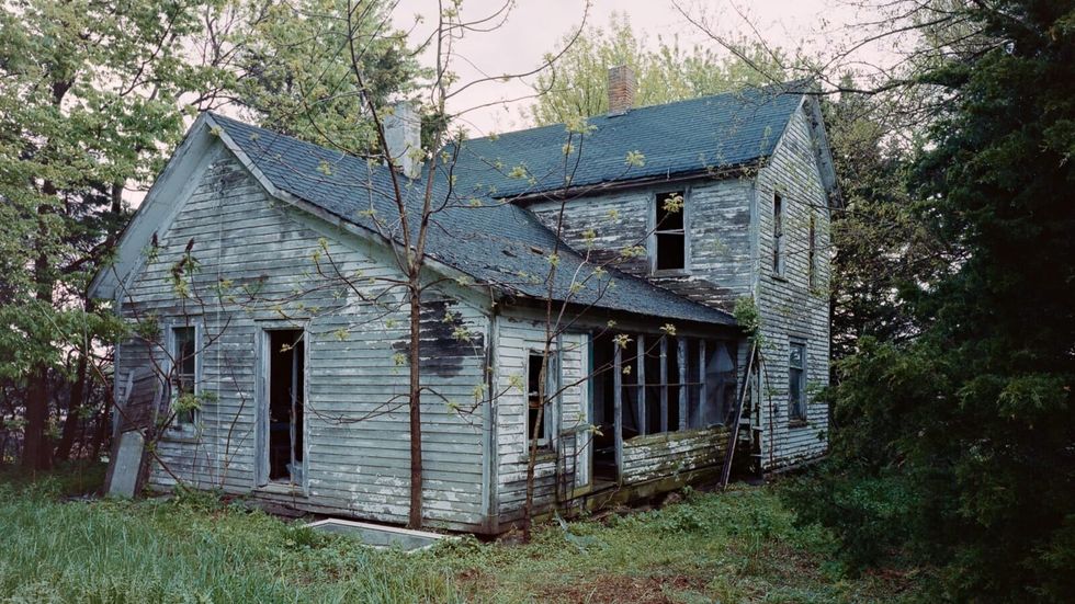 an abandoned house in a forest