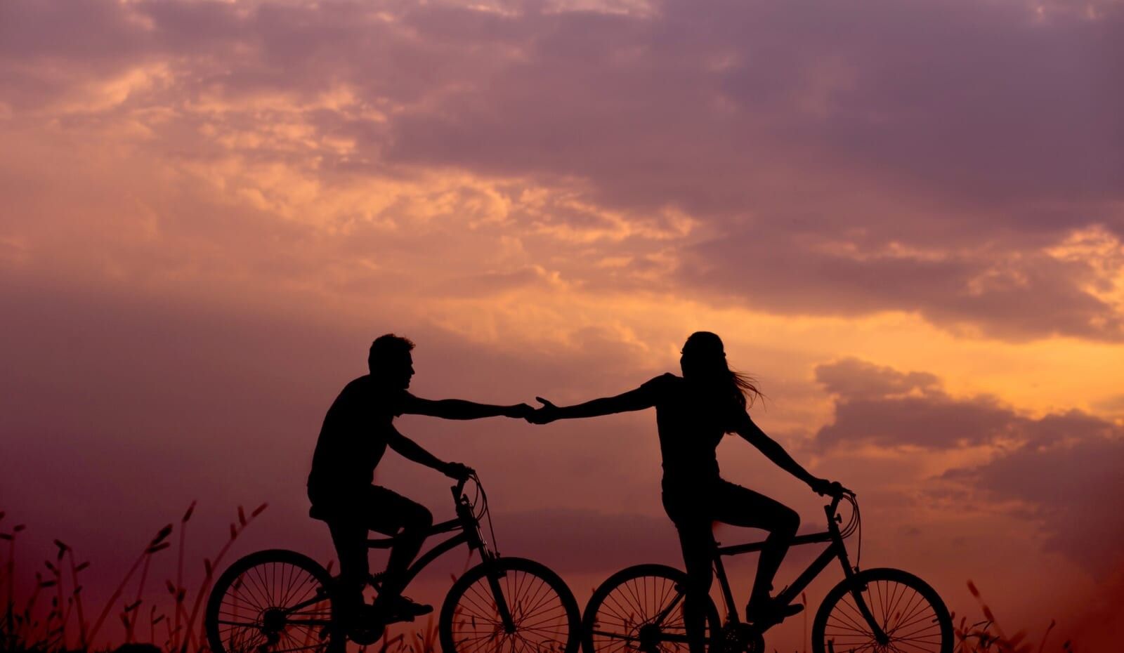 man and woman on bicycles
