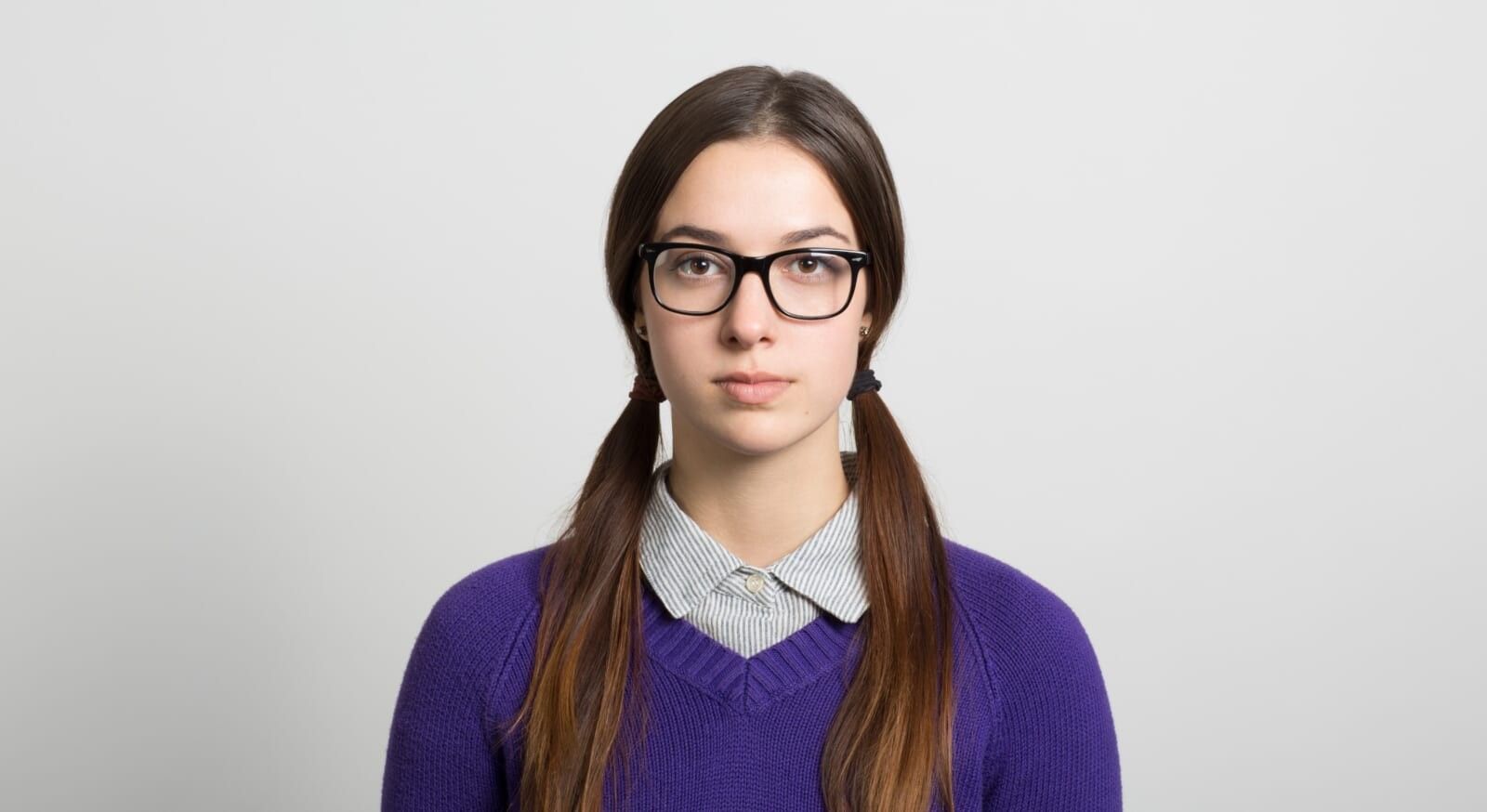 young woman wearing glasses