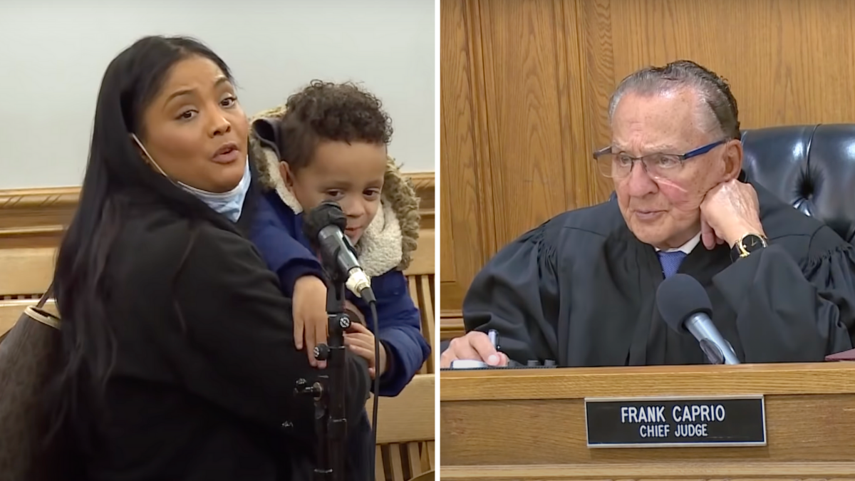 woman with little boy in her arms and an elderly judge