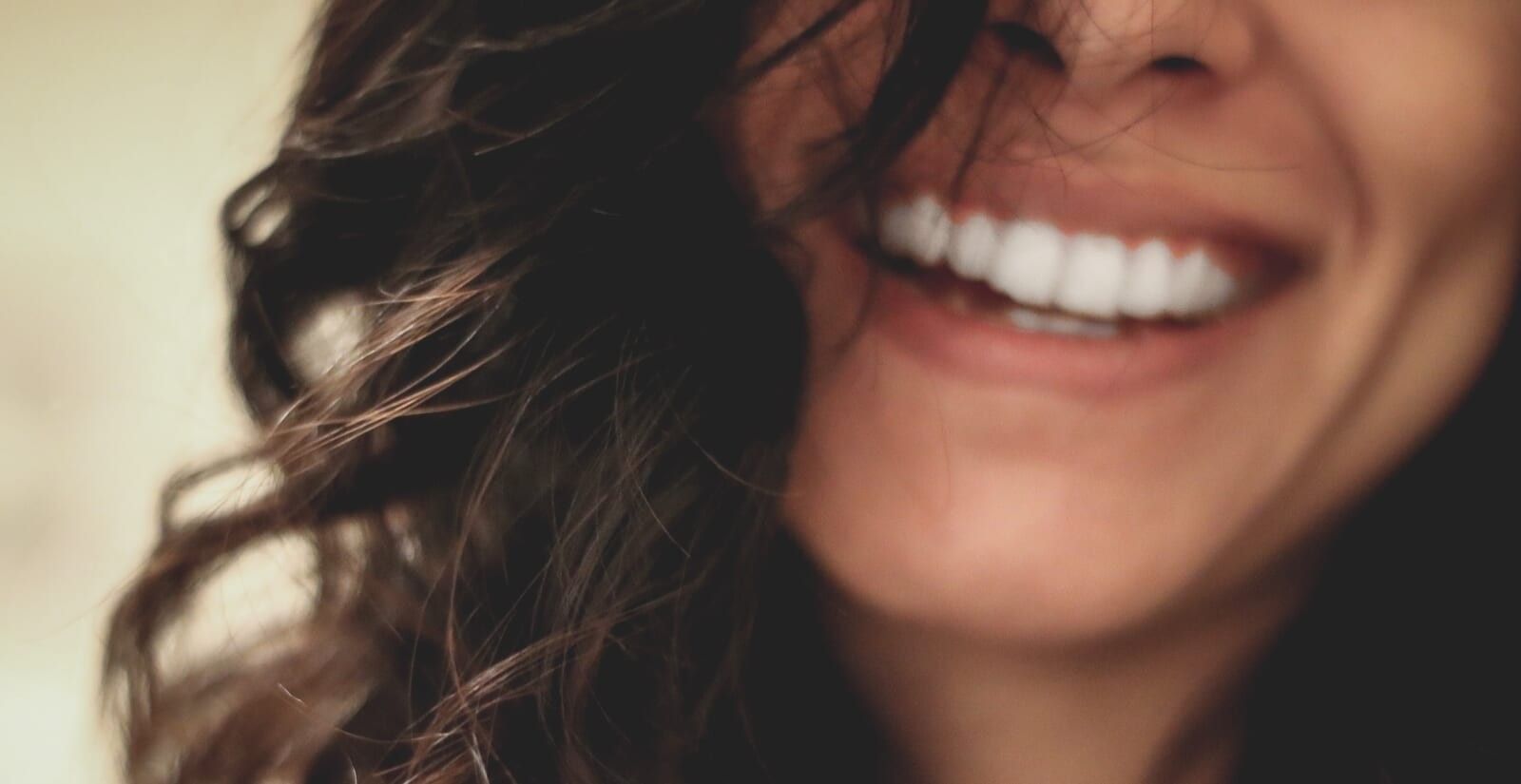 smiling woman shows her teeth