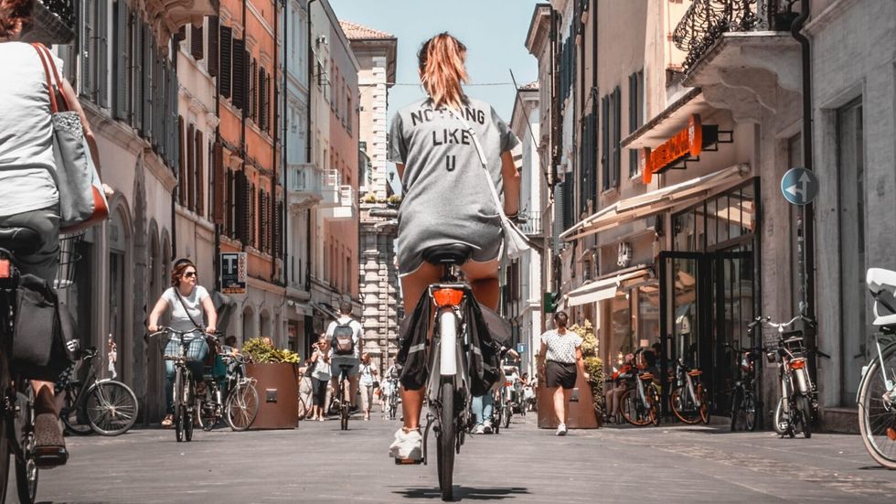woman riding bike on the street
