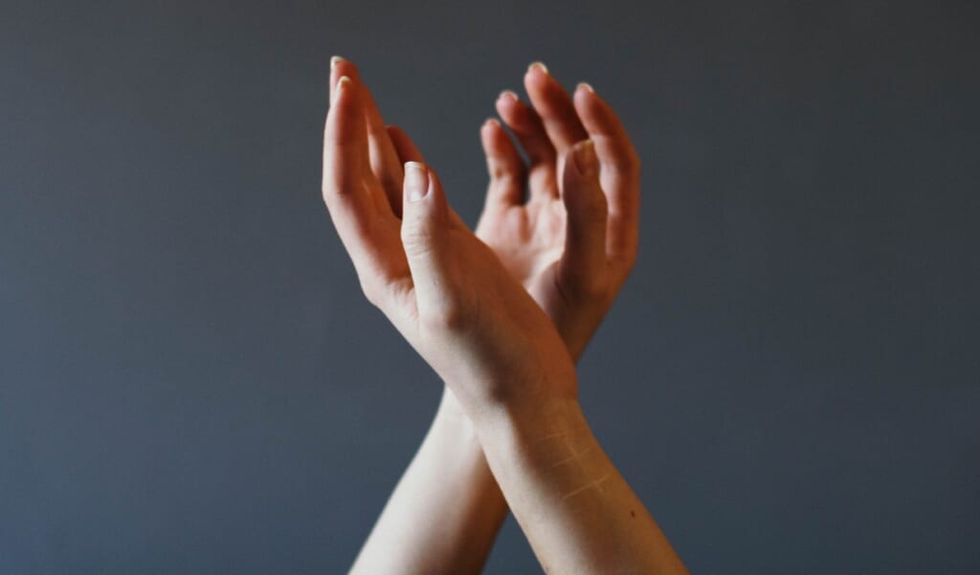 shot of hands implying a person is dancing