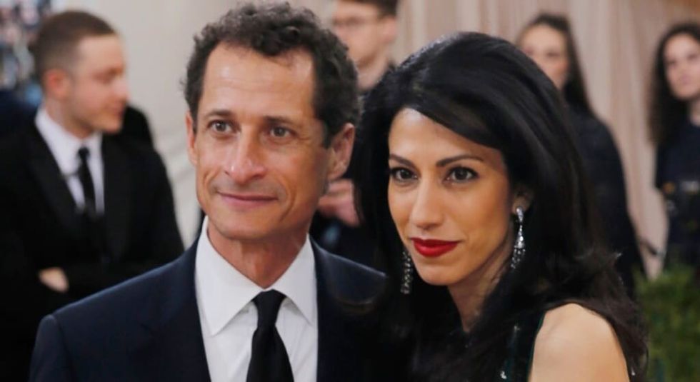 Anthony Weiner and wife Huma Abedin wearing black tie.