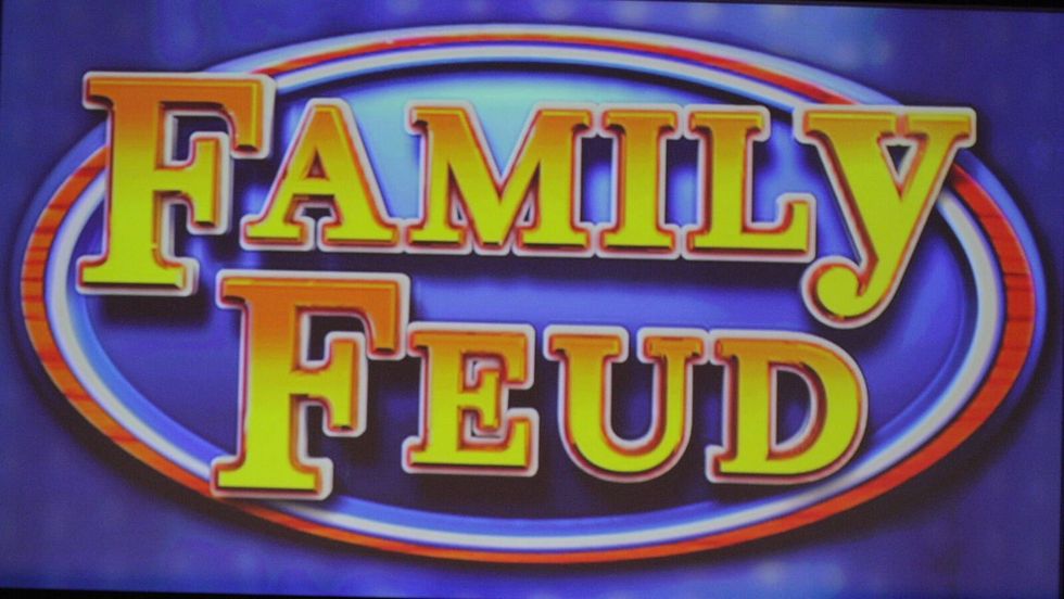 "Family Feud" in yellow text on a blue background