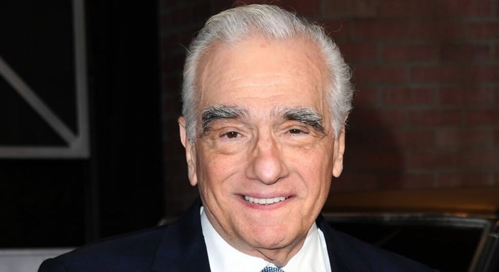 Martin Scorsese smiling at the camera