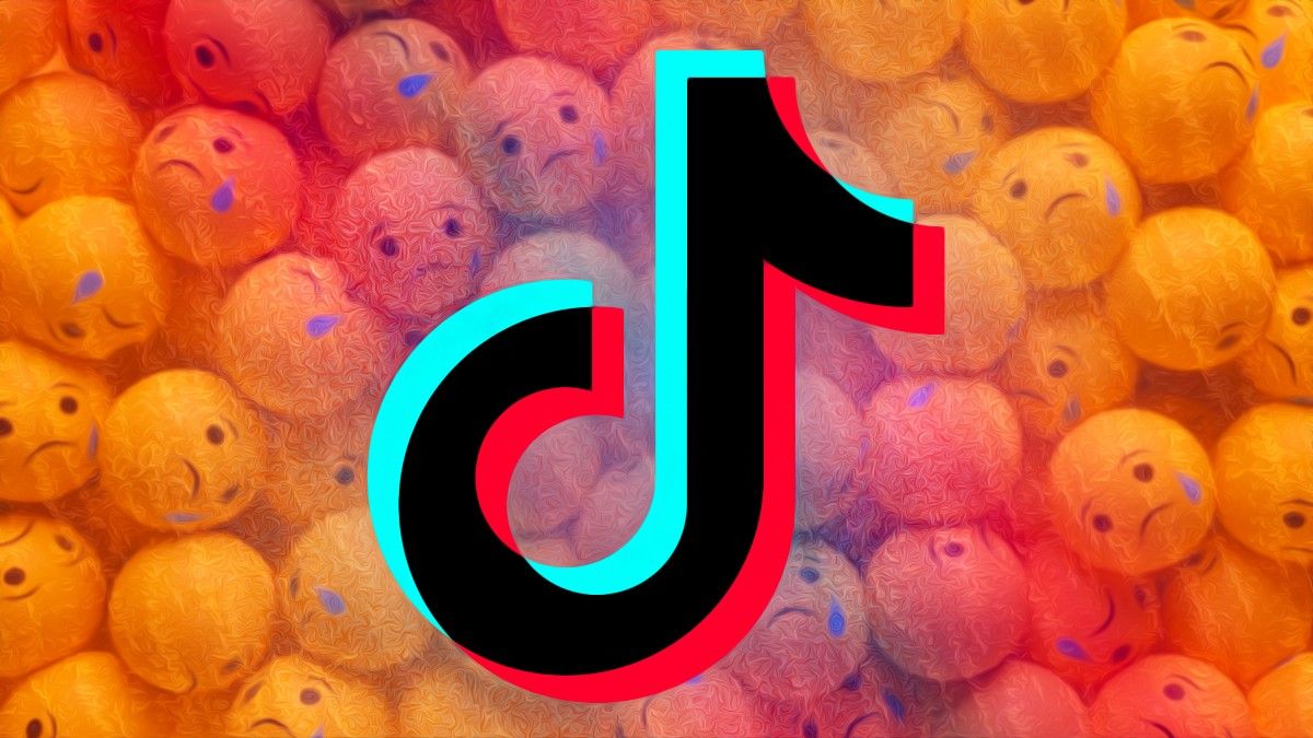 TikTok logo in front of sad emojis