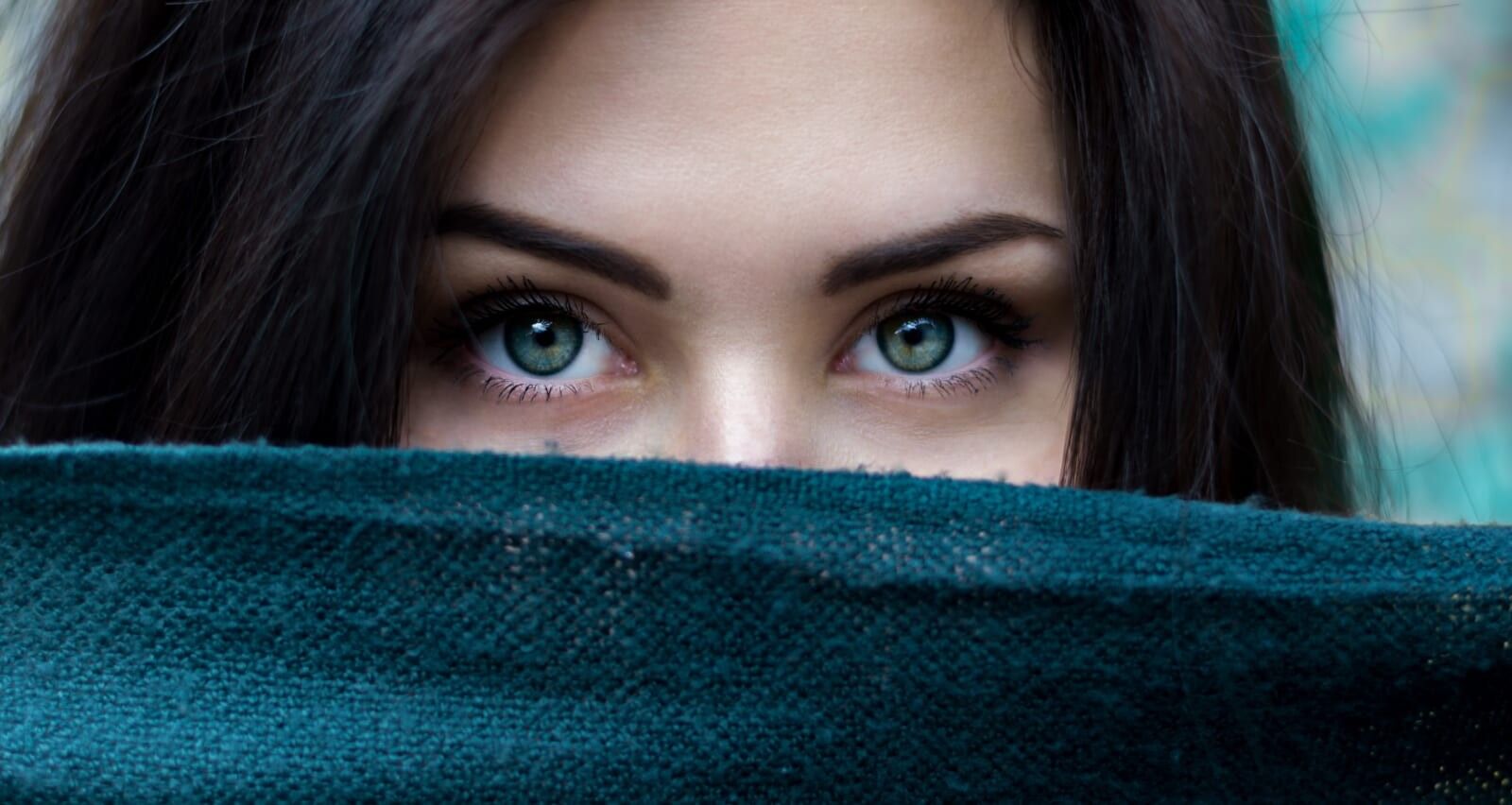 woman with blue eyes looks into lens