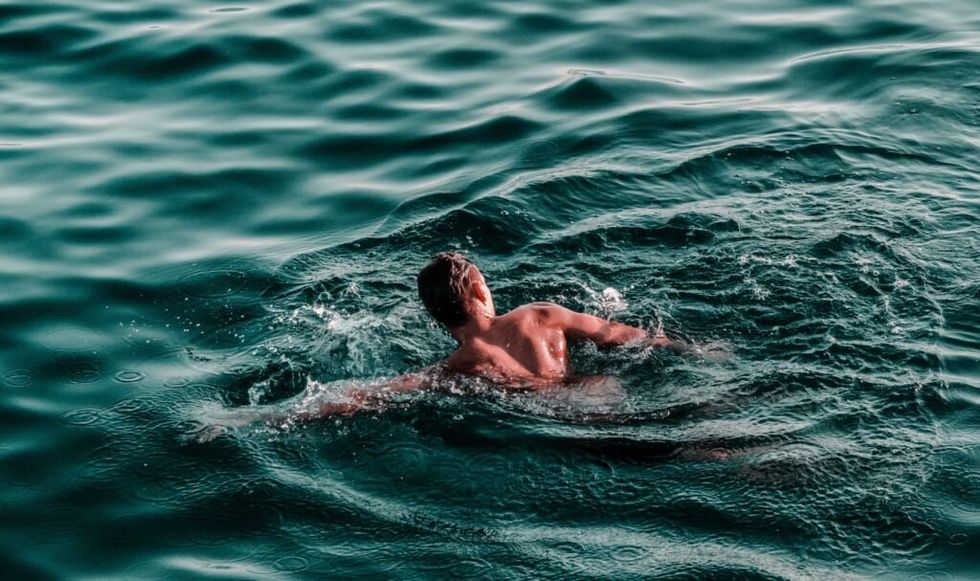 beautiful shot of man swimming