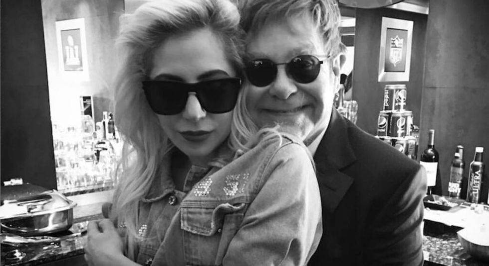Elton John hugging Lady Gaga in black and white photo