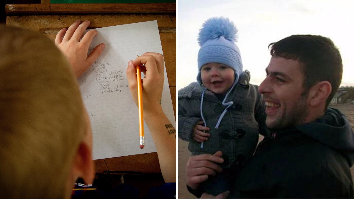 boy writing on a piece of paper and a man carrying a baby wearing a beanie on his head